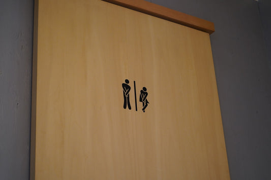 a wood door with black text on it