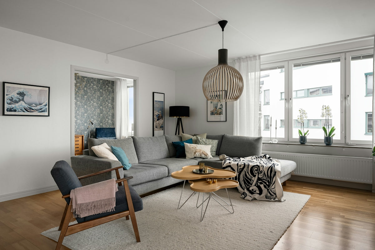 A living room filled with furniture and a large window