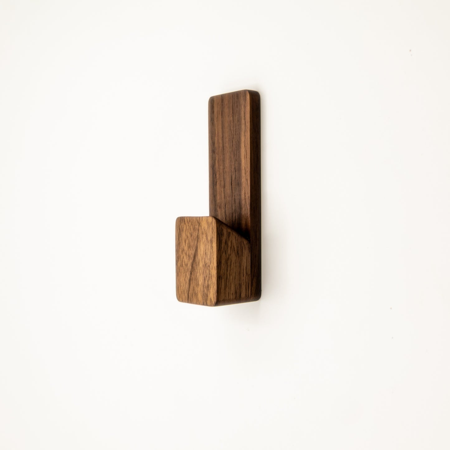 Adhesive Wooden wall hook on a white background
