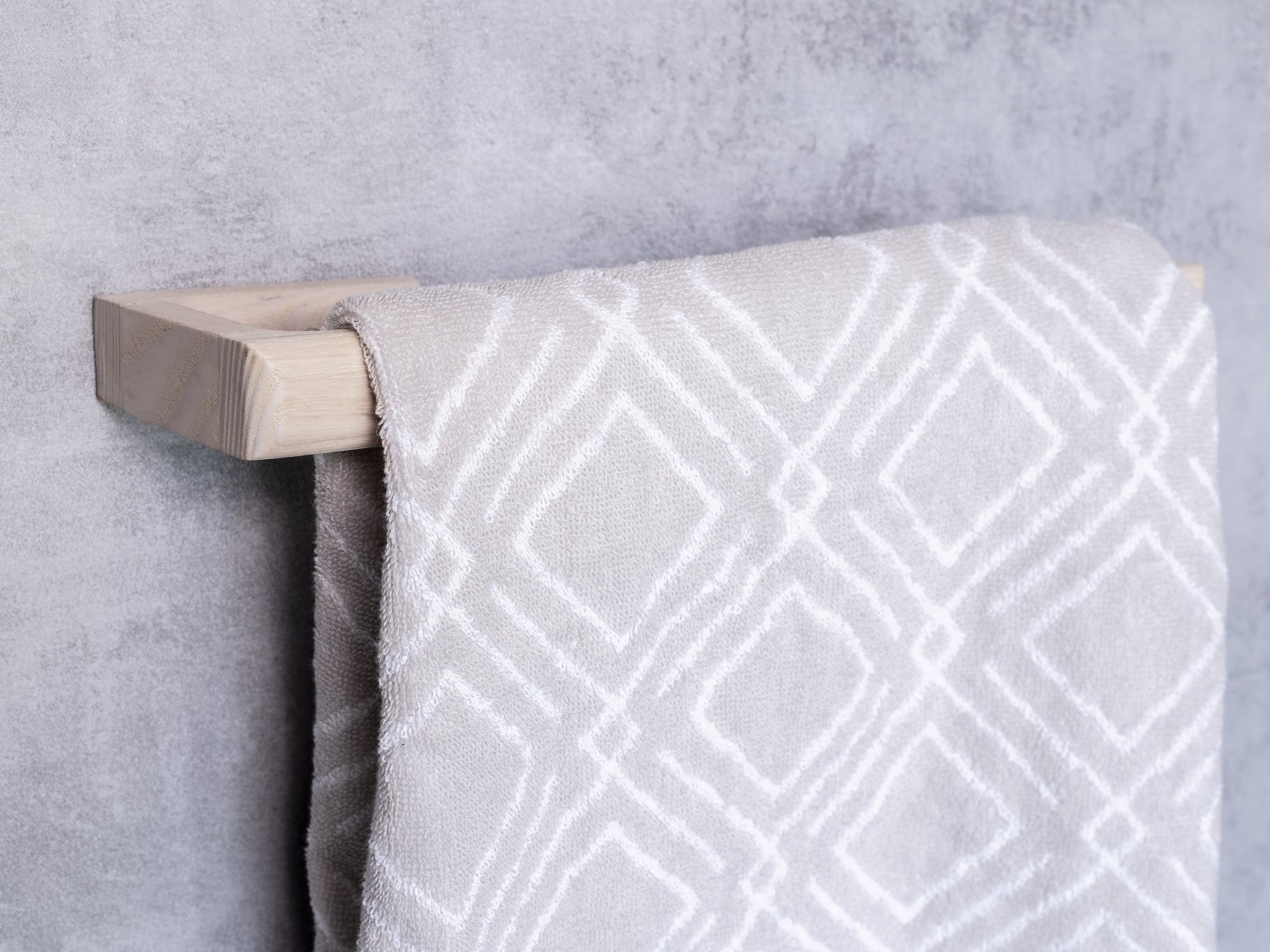 White designer towel rail, towel bar, towel rack made from solid oak by noir.design