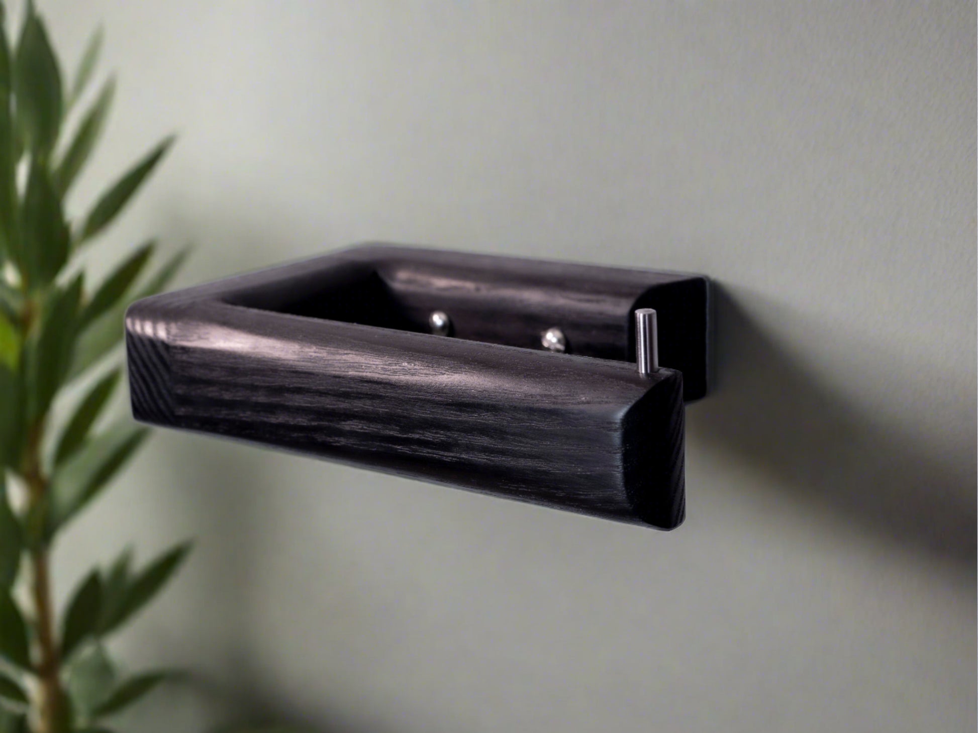 Black toilet roll holder made from wood in black