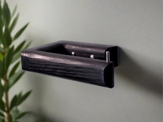 Black toilet roll holder made from wood in black