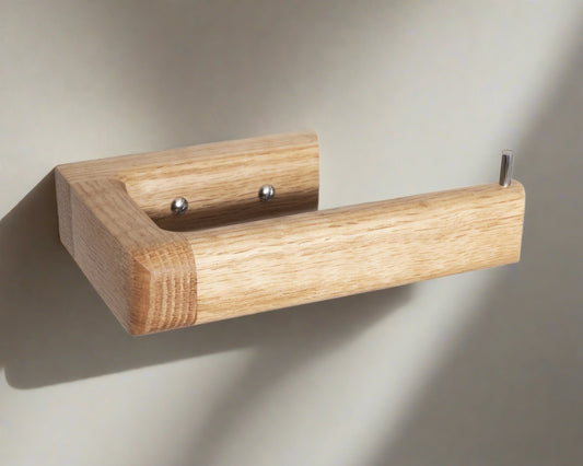 This is the Oak toilet roll holder by Noir.design. It is made from sustainable oak and finished with a high hard wearing finish. The smooth curved edges add a touch of elegance to any bathroom. It is strong and sturdy, and eco-friendly.