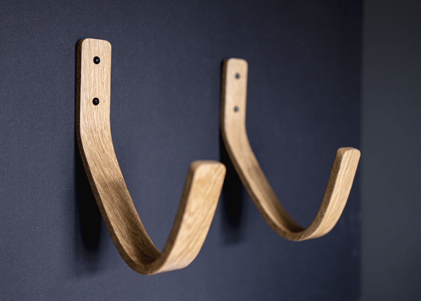 Longboard surfboard rack waves 2.0, made from solid oak heavy duty suitable for hanging all types of board. Bent wood design FSC certified suitable for the home and restaurants to display surfboards on the wall - made and designed by noir.design