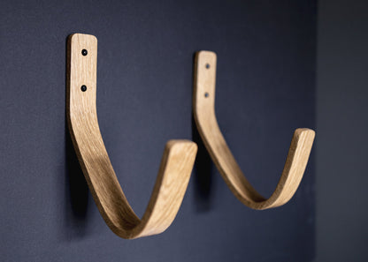 Longboard surfboard rack waves 2.0, made from solid oak heavy duty suitable for hanging all types of board. Bent wood design FSC certified suitable for the home and restaurants to display surfboards on the wall - made and designed by noir.design